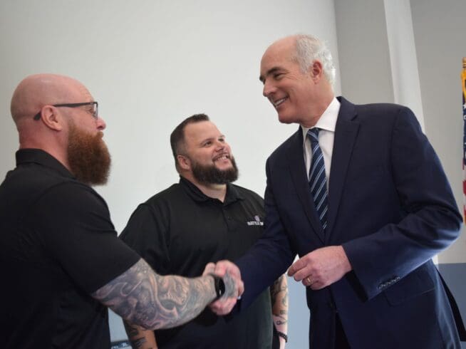Veterans Chris Yarnell and Freddie Reed join U.S. Sen. Bob Casey at the VFW Post 7293 in Whitehall on April 8, 2024.