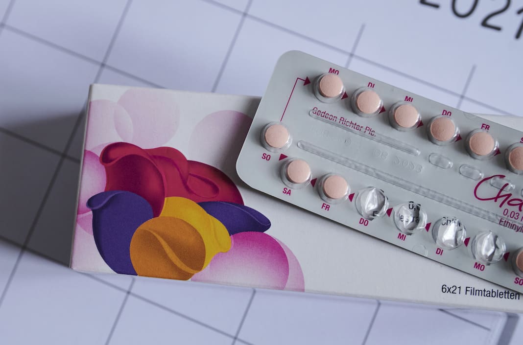 An opened package of birth control pills sits on a countertop.