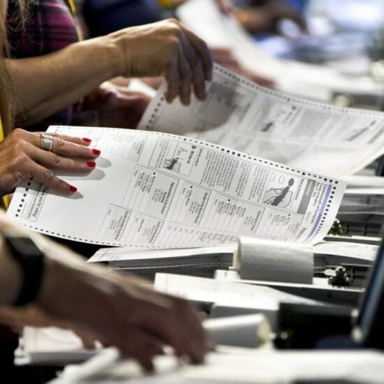 Election workers at the Allegheny County Election Division warehouse in Pittsburgh process ballots from the 2022 Pennsylvania primary on June 1, 2022 .