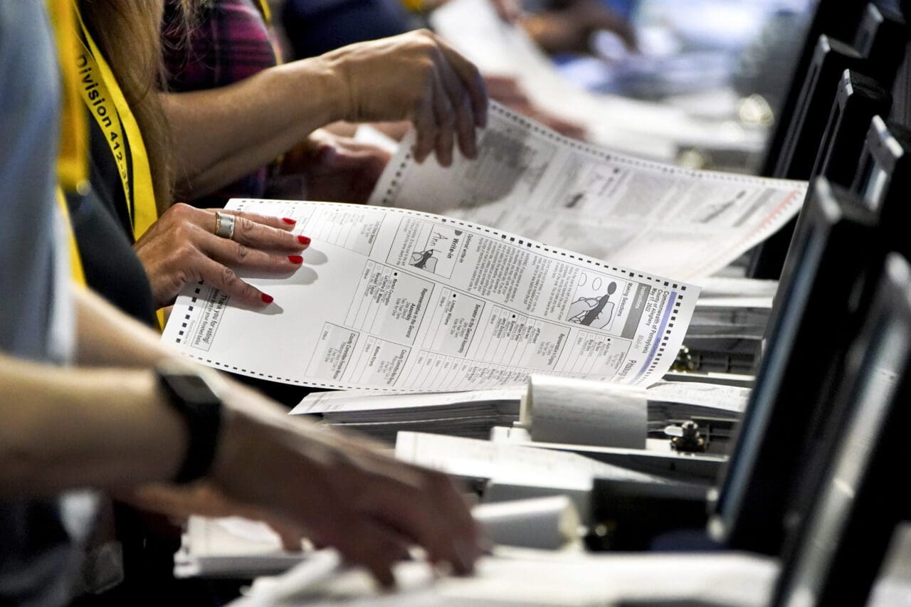 Election workers at the Allegheny County Election Division warehouse in Pittsburgh process ballots from the 2022 Pennsylvania primary on June 1, 2022 .