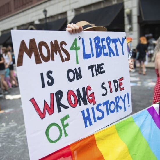 A protester holds a placard during a protest held by Philly Children's Movement against Moms For Liberty in Center City Philadelphia. Mom's For Liberty, a group from in 2021 to fight against COVID-19 Mandates, held their annual summit in Philadelphia, Pennsylvania and were met by protesters protesting the event and the actions of Mom's For Liberty. The group which is designated by the Southern Poverty Law Center as a hate group, has been a vocal voice in anti-LGBT rhetoric and the push in banning certain books from schools and libraries. (Photo by Matthew Hatcher / SOPA Images/Sipa USA)(Sipa via AP Images)