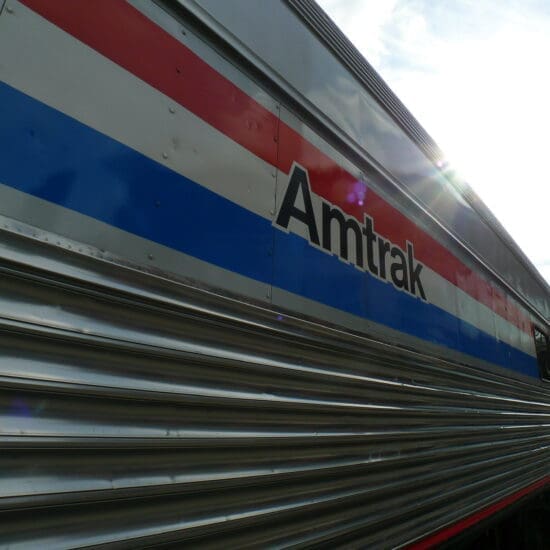 Close up of the "Amtrak" paint on an Amtrak train car.